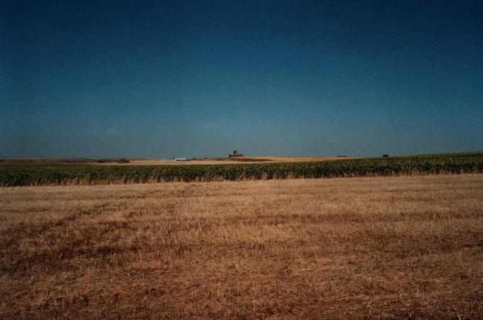 View north from the confluence. In the distance the small town of Villabaruz de Campoz is visible