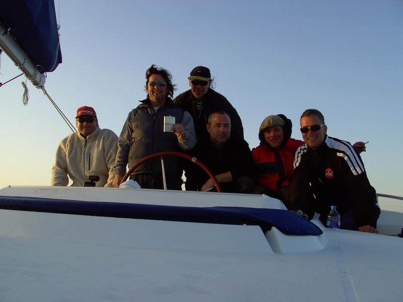 The crew at the fly bridge, with the hip flask