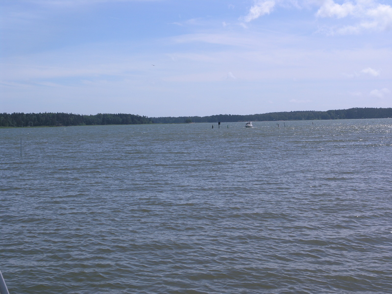 The point is located outside the sound between these two islands
