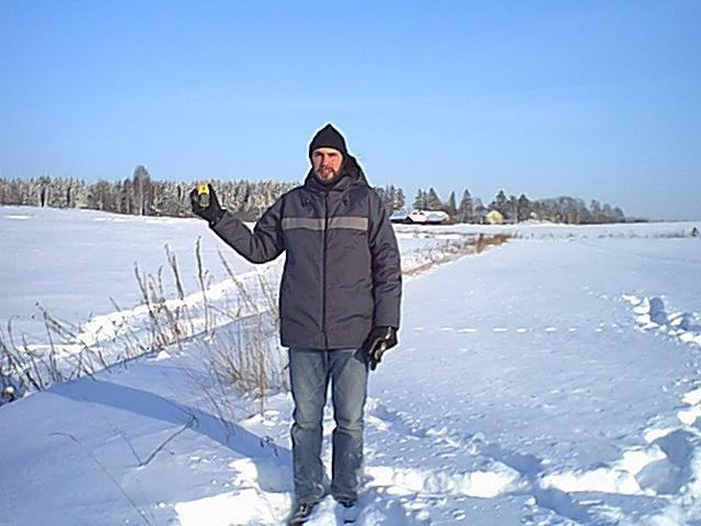 Olli "Almost" Suutela standing at the confluence point.