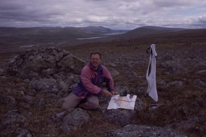 Visitor and point on top of the mountain