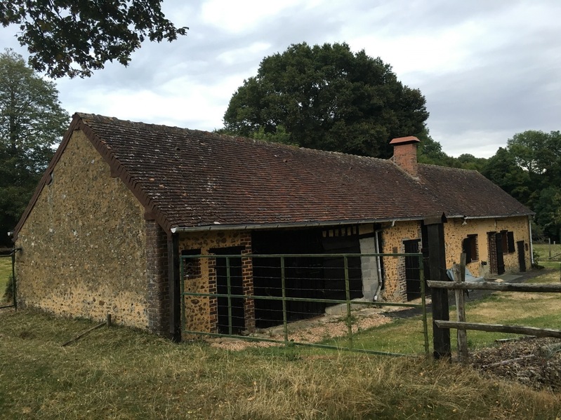 The nearby farmhouse