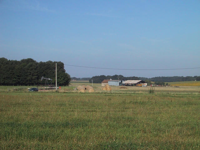 The spot of the confluence, looking west (see oil well)