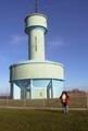 #3: Erika at the confluence point, water tower in the background