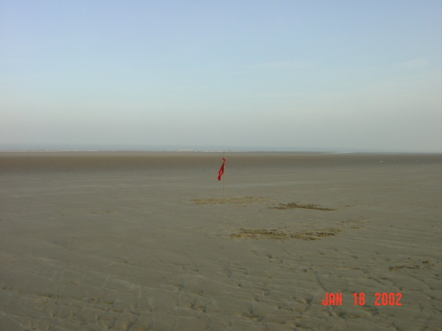 The confluence point, marked with a stick