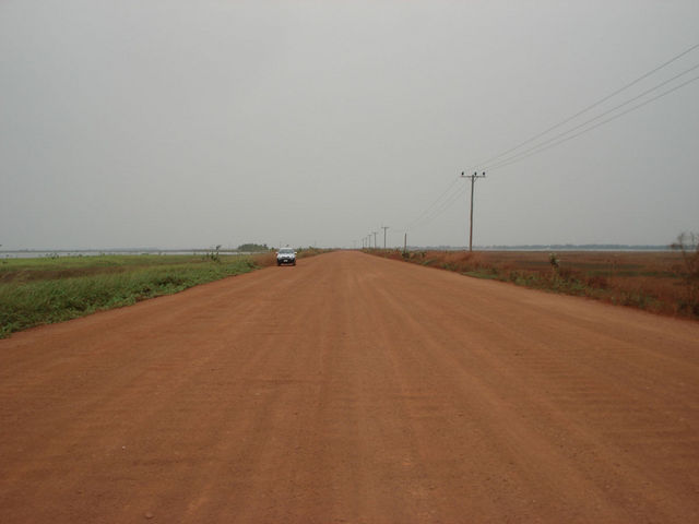 Road on the dam through the lagoon