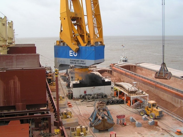 Loading bauxite at New Amsterdam, Berbice River, Guyana)