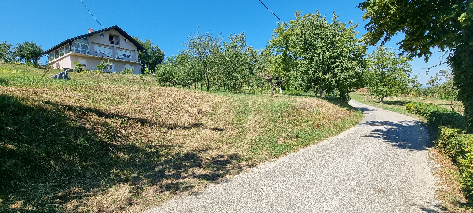 Overview - The confluence is a few metres from the road on the steeper slope in the shadow of the pole.