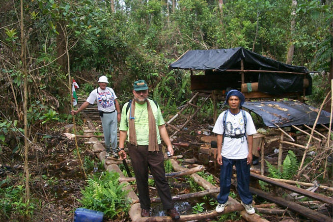 Barrie, Tom, and Sangkot Rifai (l-r) on the logging trail at a logger’s rest camp.