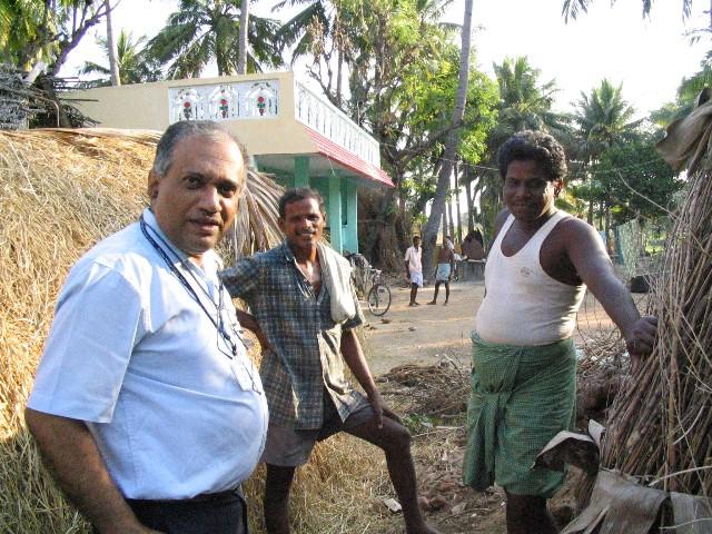 R-to-L: Mr.Udaiyaar, his uncle and my father, in his front yard. Mr.U is leaning on his kiln (which marks the spot).