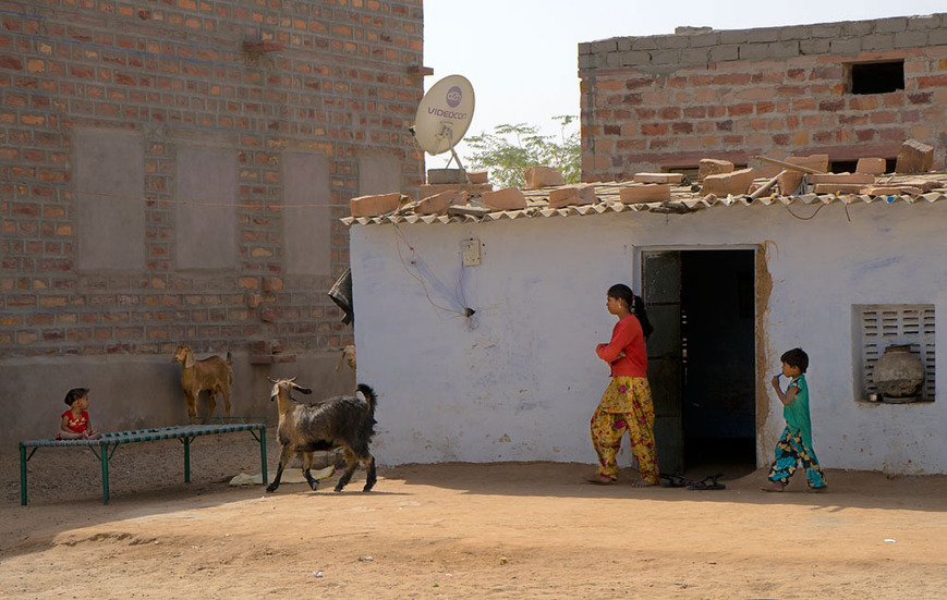 Residents and their home inside the courtyard