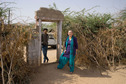 #8: At the entrance to the courtyard: A Luni resident and Candace Whalen