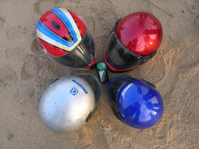 The bike helmets, arranged around the GPS in the cardinal directions