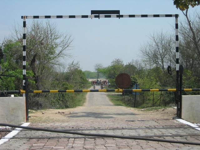 Railroad crossing between highway and confluence