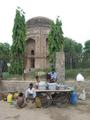 #10: Some people relaxing outside the Tomb of Paik