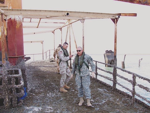 LT Stephen B. and I looking for the confluence point. It is just left of the edge of this photo