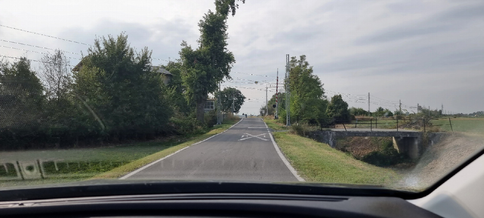 railroad crossing approaching confluence on narrow streets 