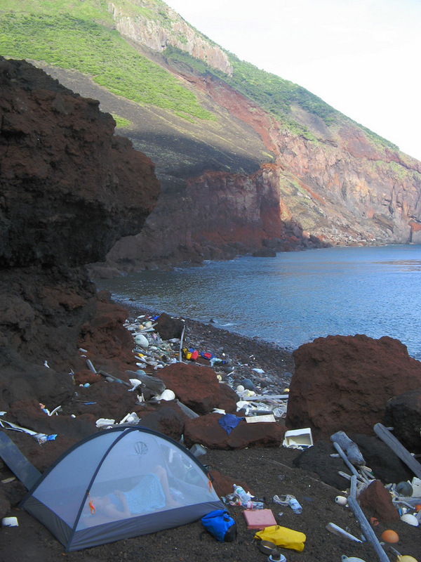 A rough camp on the uninhabited Yokoate-jima on the morning of the confluence visit.  In East Asia, where environmental thinking is still in its infancy, this amount of flotsam is normal even on the remotest coasts.