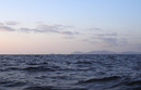 #4: Looking just west of south.  Rocks and islets and the steep hills of the Koshiki group are visible.