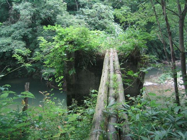 Old broken bridge over the river.