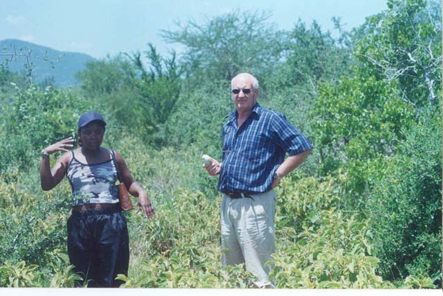 Roger and Rachel posing in the heat with Mt. Kilibasi behind them