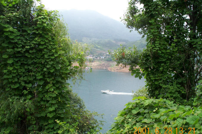 Looking west; The actual confluence point is on the lake, near the shore. You can see a ferry making a return trip in the picture.