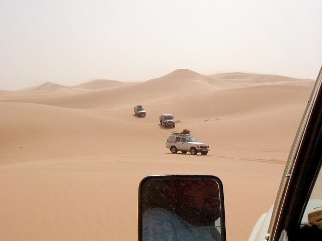 Toyota convoy in the last of the dunes in a N-S crossing of the Awbāriy Sand Sea