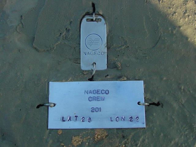 Aluminium tag at 28N 22E