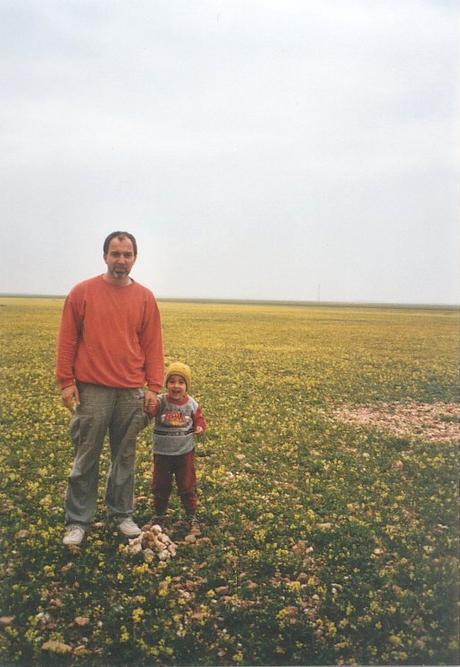 My son and me at the Confluence. The mysterious patch of stones to the right.