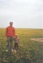 #7: My son and me at the Confluence. The mysterious patch of stones to the right.