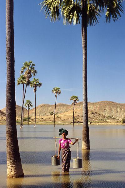 Ma San Din fetching water from the small artificial lake