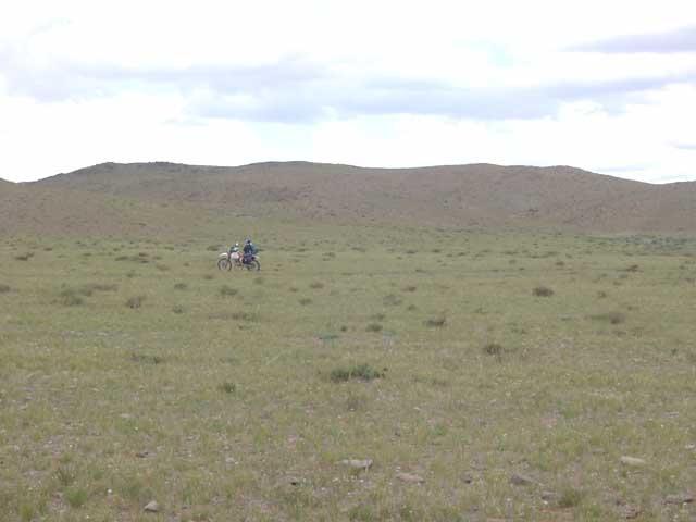 My motorcycle near earth road, view from the confluence