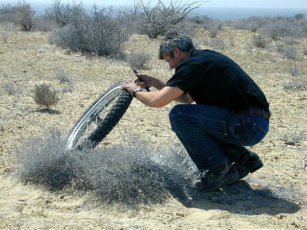 Tom fixes a flat