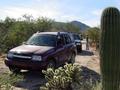 #8: Stop to discuss the bearings. A saguaro cactus in the foreground.