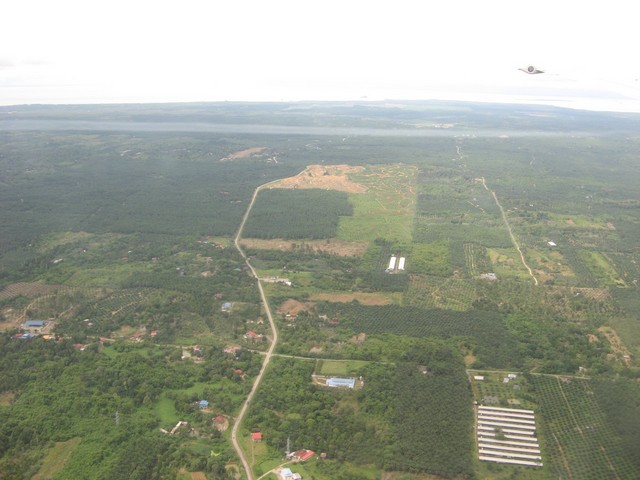 Typical view of area taken from plane flying into Sandakan. The confluence is probably somewhere near the top of the picture.