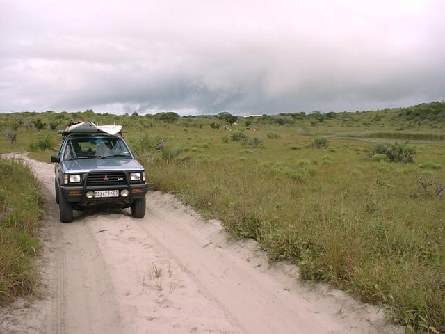 Sandy track leading off main road