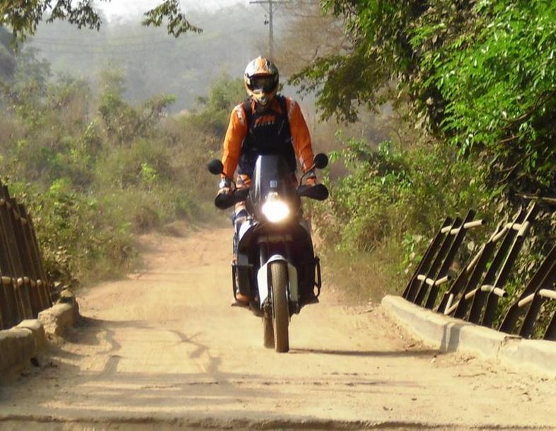 Christian crossing a small bridge