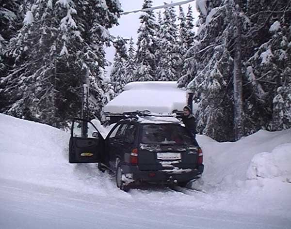 Car in front of the cabin, confluence located some 40 meters behind