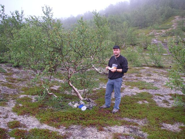 Oliver inspecting the geocache