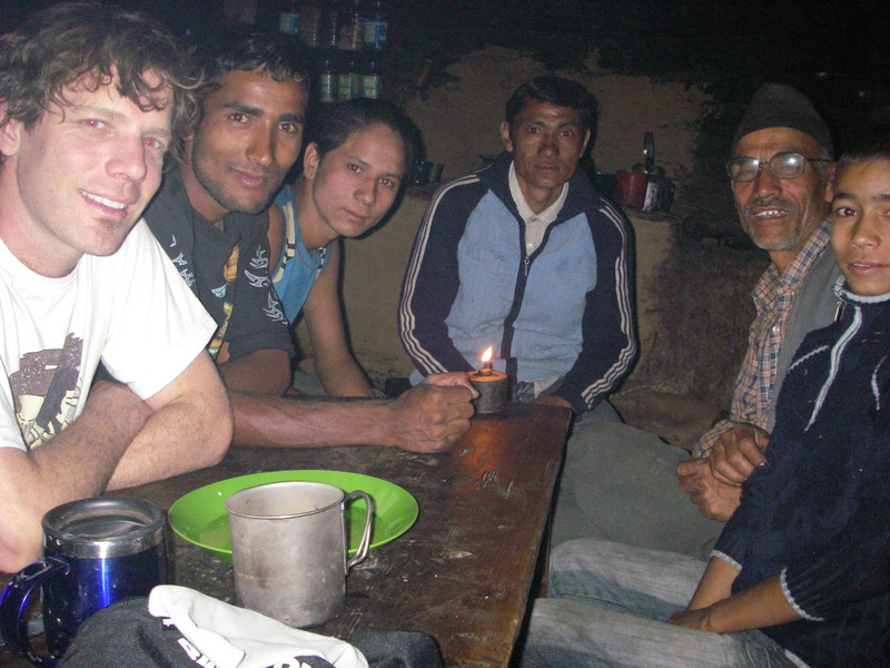 Huddled in the candlelight in the grungy pasture abode.  Greg on the left, lead mule driver, back right