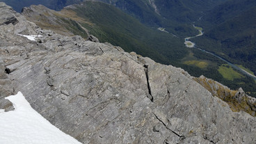 #1: Looking down onto the confluence from the cliff above and beyond to the valley below