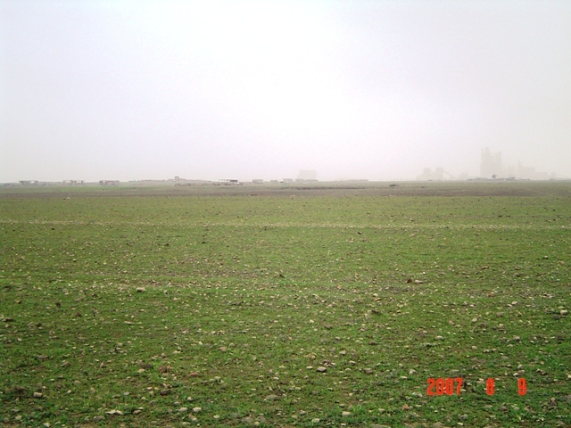 South view - a cement factory and the sea