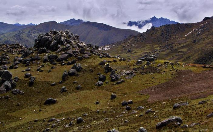 Cloud covered mountains and potato fields