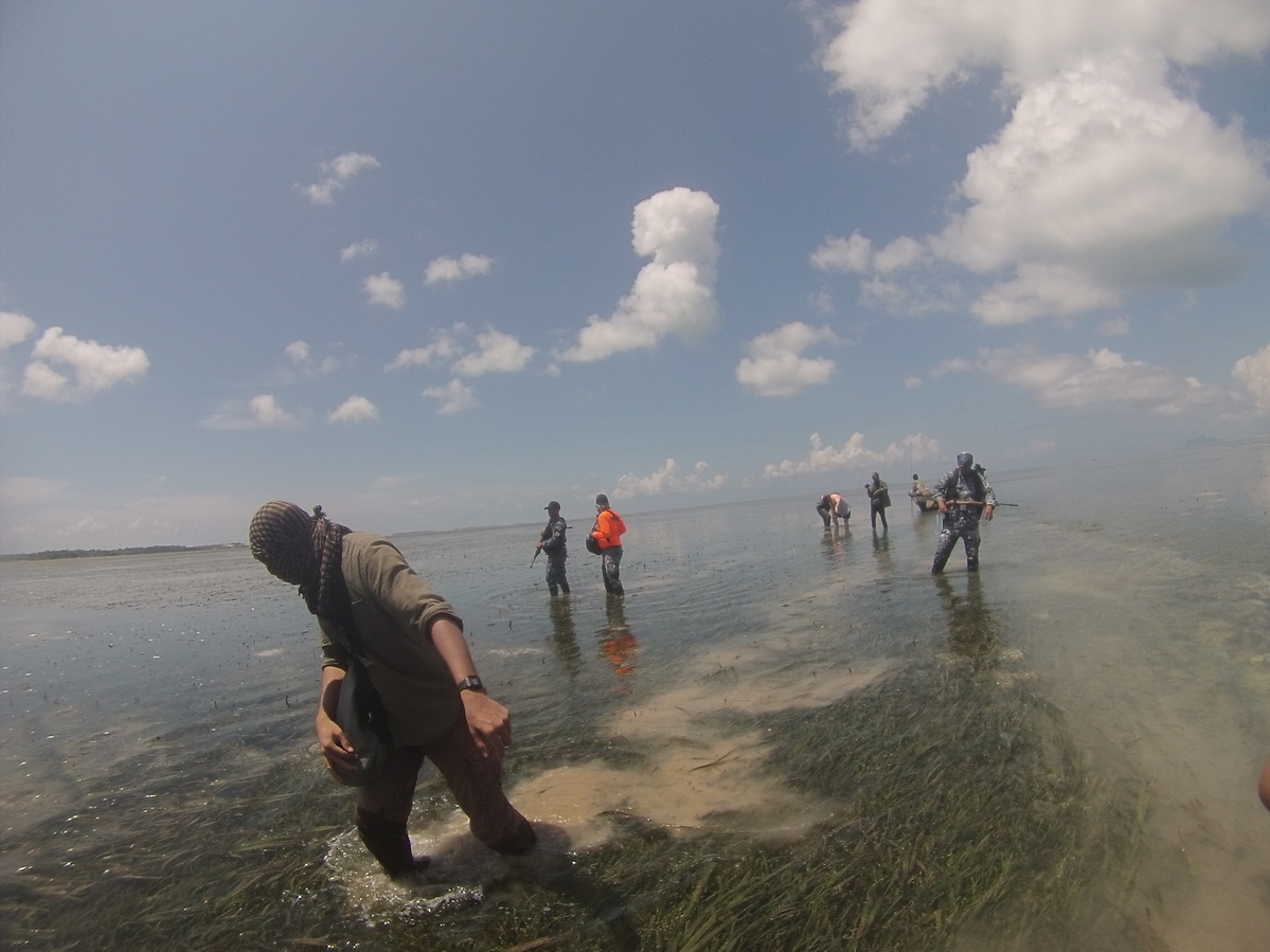 Coming ashore - note the mud, it was very difficult