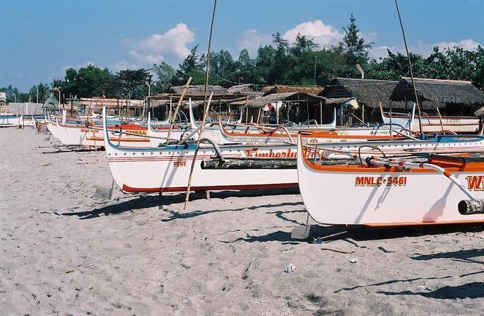 Colorful bancas lined up safe from the surf.