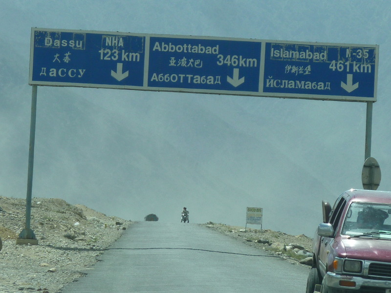 Road signs in English, Chinese, and Russian (why?)