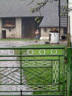 #1: The confluence of N50 E019 is just behind the barn door (i.e. behind grandma in the picture) at number 99 Zlote Lany, in the village of Jankowice, Poland.