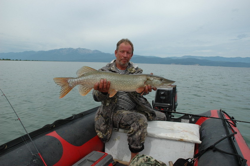 Boatman Peter Logunov, assisting to visit the CP, with a successful trophy