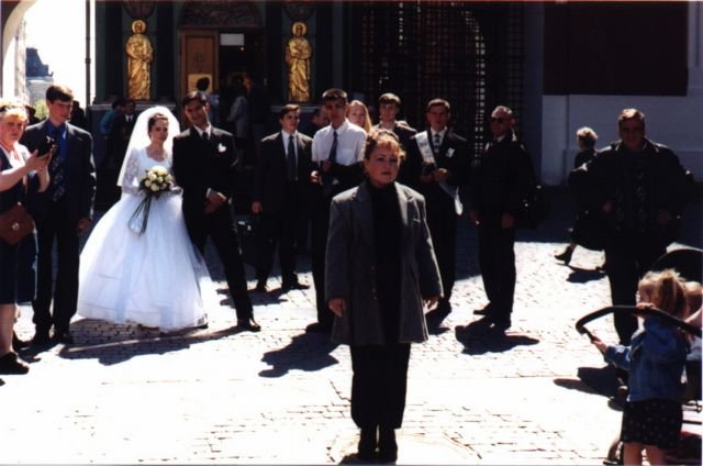 Bride and groom waiting to drop a coin on the mark