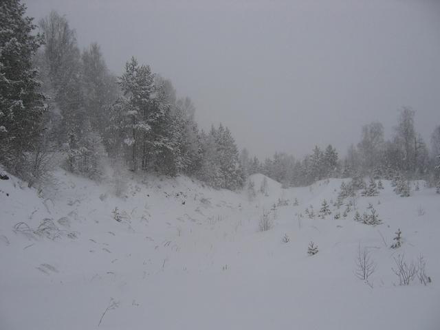 Snowy road, snowy weather. Nobody uses this road in winter, and anybody hardly uses it in summer